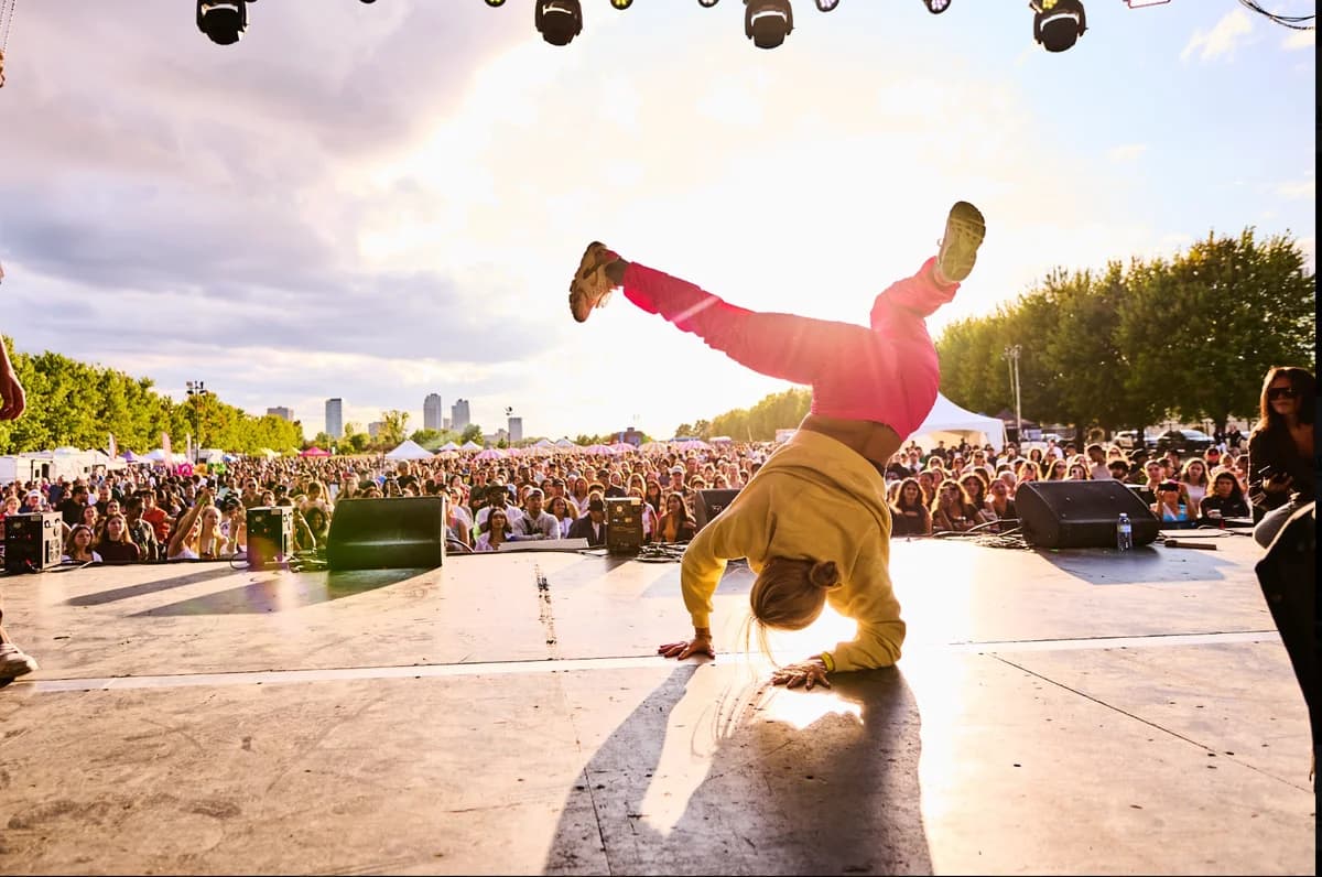 Dancer performing on stage in front of the festival crowd